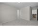 Bedroom featuring neutral walls and neutral carpet with staircase at 10543 Banyan Wood Ct, Indianapolis, IN 46239