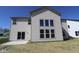 Rear exterior of home showing siding, large windows and patio at 10543 Banyan Wood Ct, Indianapolis, IN 46239