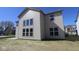 Two-story home featuring large windows and neutral siding, nestled in a Gathering-friendly neighborhood at 10543 Banyan Wood Ct, Indianapolis, IN 46239