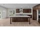 Modern kitchen featuring a large island, stainless steel appliances, and ample cabinet space at 10543 Banyan Wood Ct, Indianapolis, IN 46239