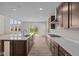 Spacious kitchen featuring an island, stainless steel appliances, and plenty of cabinet space at 10543 Banyan Wood Ct, Indianapolis, IN 46239