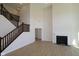 Bright living room featuring a fireplace, staircase and hardwood floors at 10543 Banyan Wood Ct, Indianapolis, IN 46239