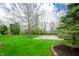 Lush backyard featuring a basketball court and ample green space for outdoor activities at 12507 Doe Ln, Indianapolis, IN 46236