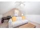 Bonus room features a white sofa, piano, and access to bedroom at 12507 Doe Ln, Indianapolis, IN 46236