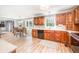 Bright kitchen with wood cabinets, modern appliances, and adjacent breakfast area at 12507 Doe Ln, Indianapolis, IN 46236