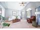Bright living room featuring neutral walls, large windows, and vaulted ceiling at 12507 Doe Ln, Indianapolis, IN 46236