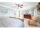 Well-lit primary bedroom showing the sitting area, large windows, and ensuite bathroom at 12507 Doe Ln, Indianapolis, IN 46236