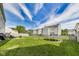 This spacious backyard features a grassy lawn, trampoline, seating area, and fencing at 12552 Majestic Way, Fishers, IN 46037