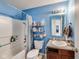 Bathroom featuring blue walls, vanity and a shower with a shower curtain at 12552 Majestic Way, Fishers, IN 46037