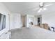 Versatile bonus room with neutral carpeting, ample natural light and storage options, ready for customization at 12552 Majestic Way, Fishers, IN 46037
