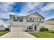 Traditional two-story home featuring a well-maintained lawn and an attached two-car garage at 12552 Majestic Way, Fishers, IN 46037