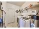 Well-equipped laundry room featuring modern washer and dryer units, ample shelving and storage space at 12552 Majestic Way, Fishers, IN 46037