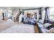 Spacious living room with comfortable seating, neutral carpet, and an open layout, perfect for Gathering gatherings at 12552 Majestic Way, Fishers, IN 46037