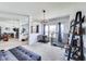 Open living space with dog kennels, a modern sofa, and ample natural light at 12552 Majestic Way, Fishers, IN 46037