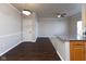 Open floor plan blends dining with wood-look floors and a breakfast bar for seamless living at 12926 University Cres # 2C, Carmel, IN 46032