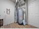 Basement utility area featuring a water heater, air filter, and utility access at 1321 Savannah Blvd, Shelbyville, IN 46176