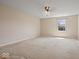 Spacious bedroom with neutral paint, plush carpeting, and abundant light at 1321 Savannah Blvd, Shelbyville, IN 46176