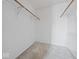 Walk-in closet space with carpeting and clothing rods installed on the wall at 1321 Savannah Blvd, Shelbyville, IN 46176