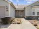 Inviting front entrance featuring a beautifully landscaped walkway and decorative potted plants at 1321 Savannah Blvd, Shelbyville, IN 46176