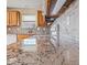 Bright kitchen features granite countertops, tile backsplash, and wooden cabinetry at 1321 Savannah Blvd, Shelbyville, IN 46176