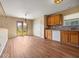 Kitchen/Dining area includes wood floors, granite counters, and bright natural lighting at 1321 Savannah Blvd, Shelbyville, IN 46176