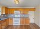 Bright kitchen features stainless appliances, granite countertops and wood floors at 1321 Savannah Blvd, Shelbyville, IN 46176