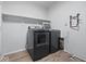 Laundry room featuring a modern black washing machine and dryer set at 1321 Savannah Blvd, Shelbyville, IN 46176
