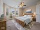 Beautiful primary bedroom with ceiling fan, bay windows, and comfortable furniture at 1321 Savannah Blvd, Shelbyville, IN 46176