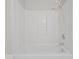 Bright white shower and tub combination with built in shelving at 1321 Savannah Blvd, Shelbyville, IN 46176