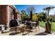 Backyard featuring a patio with outdoor furniture, grill and hot tub surrounded by green grass at 1513 Tottenham Dr, Danville, IN 46122