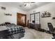 Bedroom with a wooden closet and desk near a window and sports equipment at 1513 Tottenham Dr, Danville, IN 46122