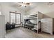 Bedroom with white bunk beds, dresser, and natural light from the window at 1513 Tottenham Dr, Danville, IN 46122