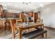 A dining area showcases wood table and chairs, warm lighting, and open kitchen concept at 1513 Tottenham Dr, Danville, IN 46122