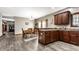 Bright dining room featuring a wooden table set, modern lighting, and neutral paint at 1513 Tottenham Dr, Danville, IN 46122