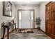 Inviting entryway with a neutral color scheme, stylish wood flooring, and natural light at 1513 Tottenham Dr, Danville, IN 46122