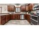 Charming kitchen boasts wooden cabinets, stainless steel appliances, and ample counter space at 1513 Tottenham Dr, Danville, IN 46122