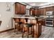 Gourmet kitchen with granite countertops, stainless steel appliances, and custom wood cabinetry at 1513 Tottenham Dr, Danville, IN 46122