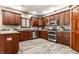 Modern kitchen featuring dark wood cabinets, stainless steel appliances, and beautiful countertops at 1513 Tottenham Dr, Danville, IN 46122