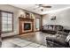 Comfortable living room with a decorative fireplace, plush seating, and modern flooring at 1513 Tottenham Dr, Danville, IN 46122