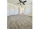 Carpeted bedroom with white walls and doors, plus a ceiling fan at 1623 Senior Ct, Shelbyville, IN 46176