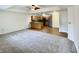 Inviting living room flows into a modern kitchen with stainless steel appliances at 1623 Senior Ct, Shelbyville, IN 46176