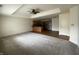 Open-concept living room and kitchen featuring carpeted floors and modern appliances at 1623 Senior Ct, Shelbyville, IN 46176