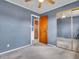 This bedroom features neutral carpeting and a sliding mirror door closet at 1816 N Moreland Ave, Indianapolis, IN 46222