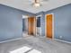 This bedroom features neutral carpeting and a sliding mirror door closet at 1816 N Moreland Ave, Indianapolis, IN 46222