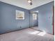 This bedroom features neutral carpeting and a sliding mirror door closet at 1816 N Moreland Ave, Indianapolis, IN 46222