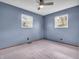 This bedroom features neutral carpeting and light blue walls at 1816 N Moreland Ave, Indianapolis, IN 46222