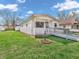 Inviting single story home with a cute front porch and accessible ramp at 1816 N Moreland Ave, Indianapolis, IN 46222