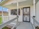 Inviting front porch with decorative security door, creating a charming and secure entry at 1816 N Moreland Ave, Indianapolis, IN 46222