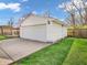 Detached two-car garage featuring carriage doors and manicured landscaping at 1816 N Moreland Ave, Indianapolis, IN 46222