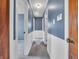 This hallway features neutral carpeting and is adorned with blue paneled walls at 1816 N Moreland Ave, Indianapolis, IN 46222